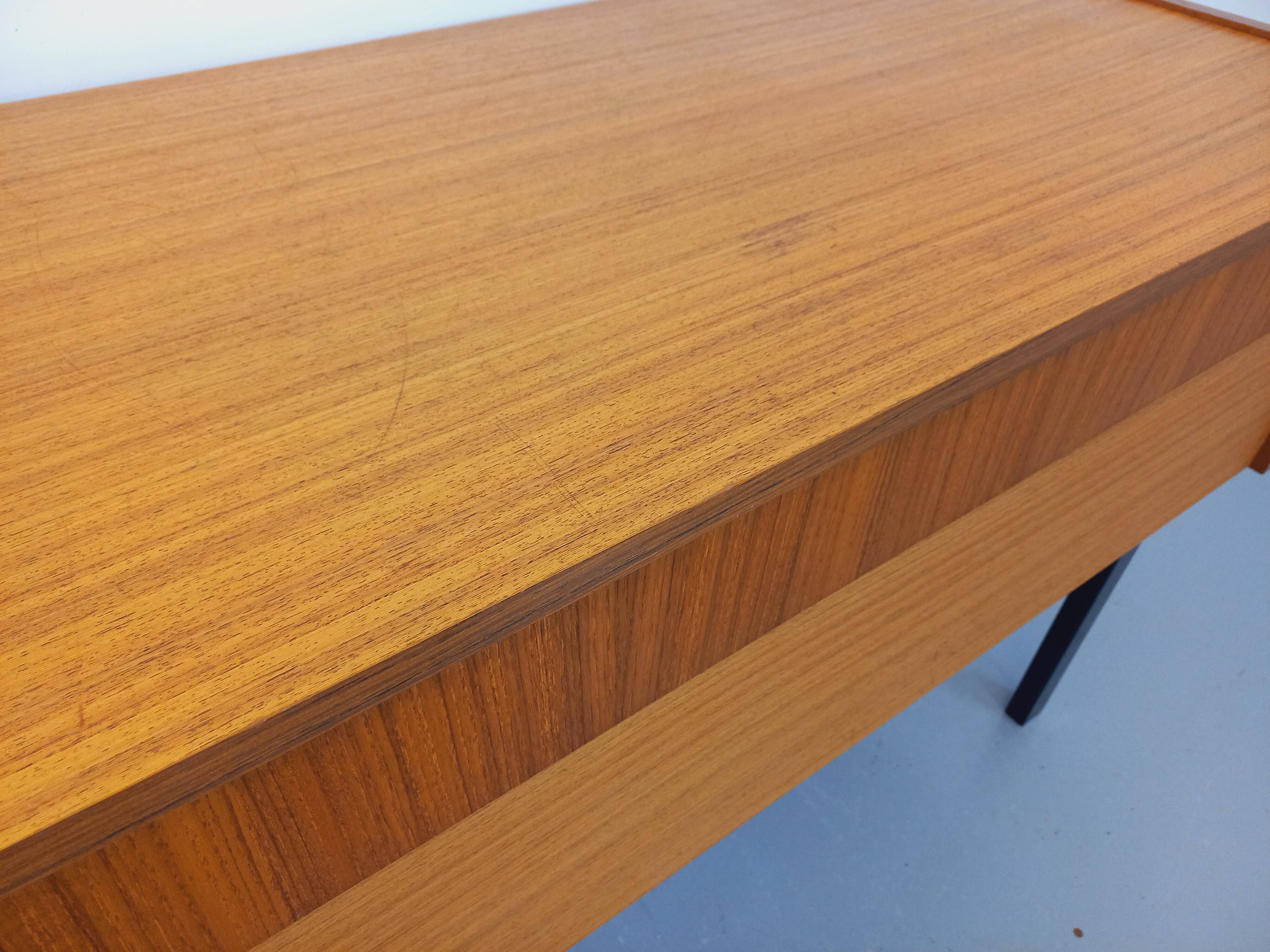 Vintage teak and black metal storage unit / chest on legs from the 70s