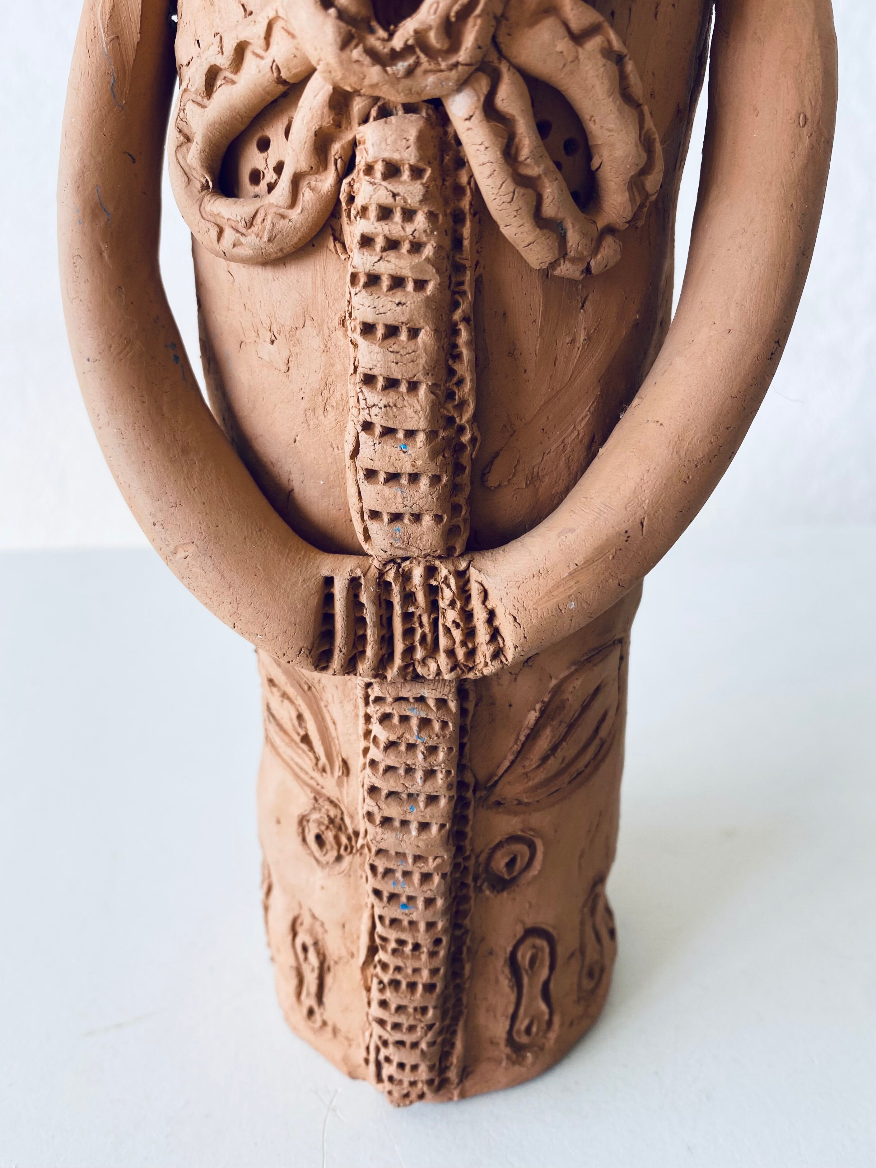 Terracotta personified vase