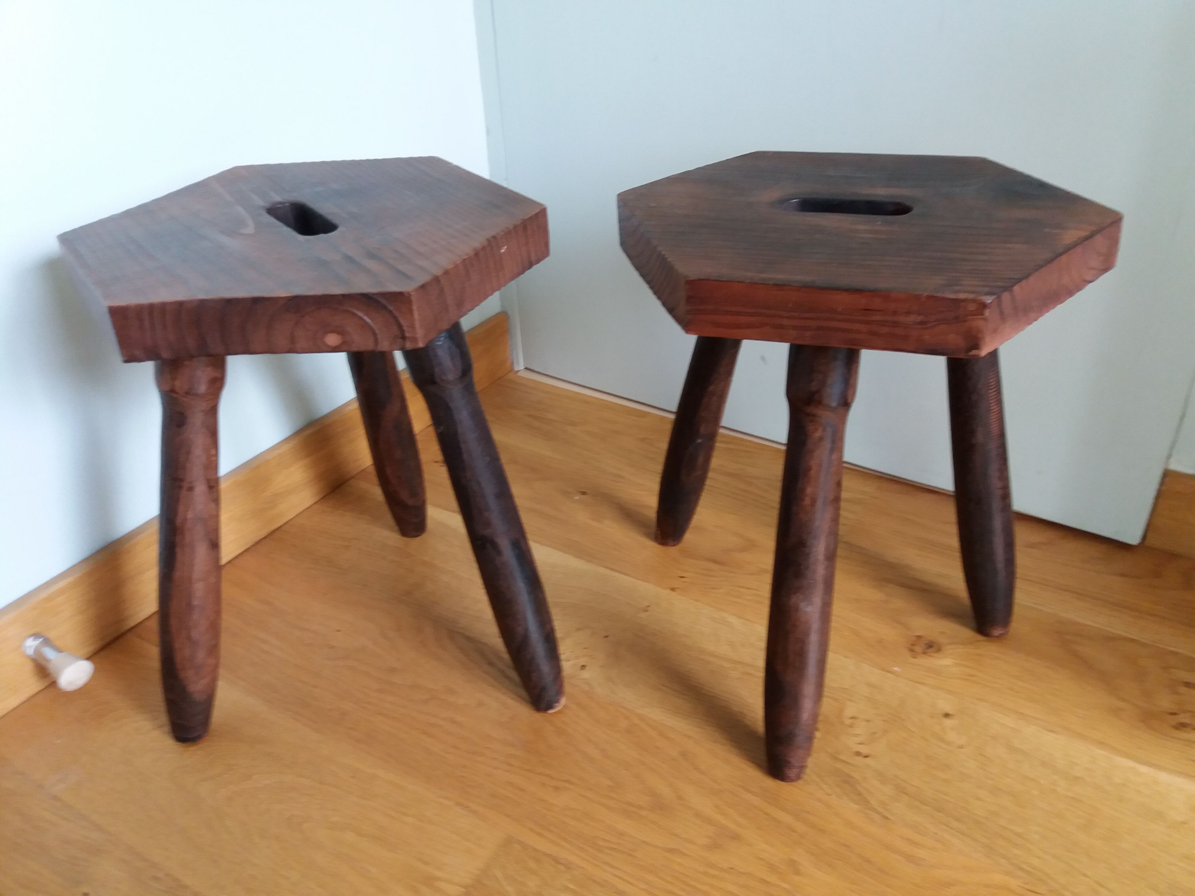 2 wooden tripod stools