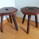 2 wooden tripod stools