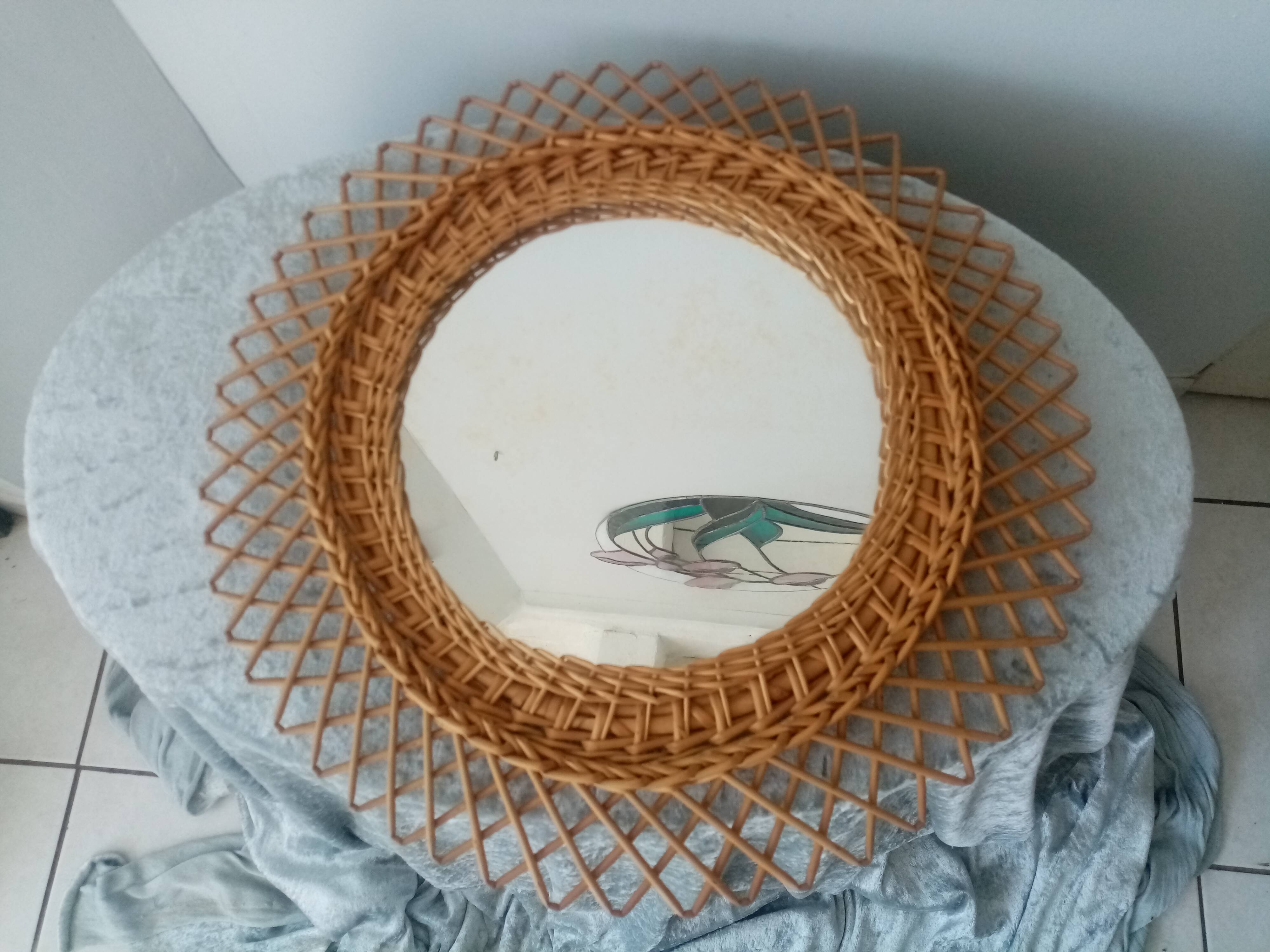 Old vintage sun mirror in rattan braid 60 years