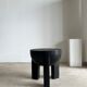 Black mango wood tripod side table with a semi-spherical top, height: 45 cm, diameter: 44 cm.