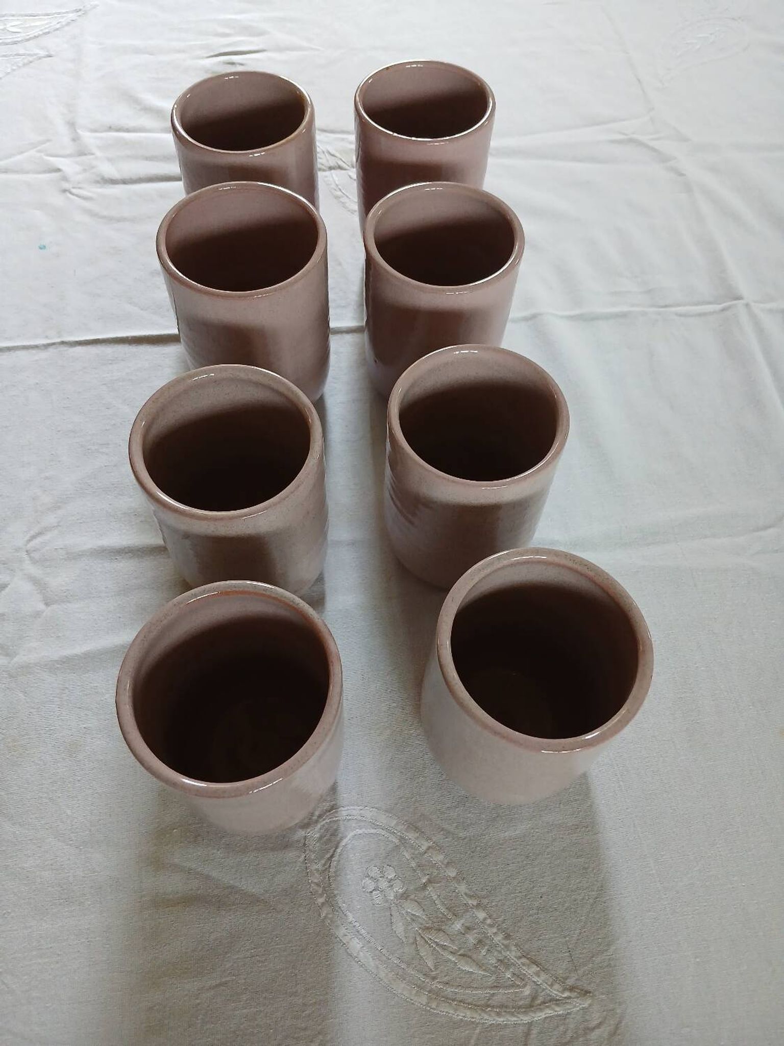 8 signed enamelled ceramic mugs