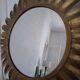 Large sun mirror in gilded metal. 1960