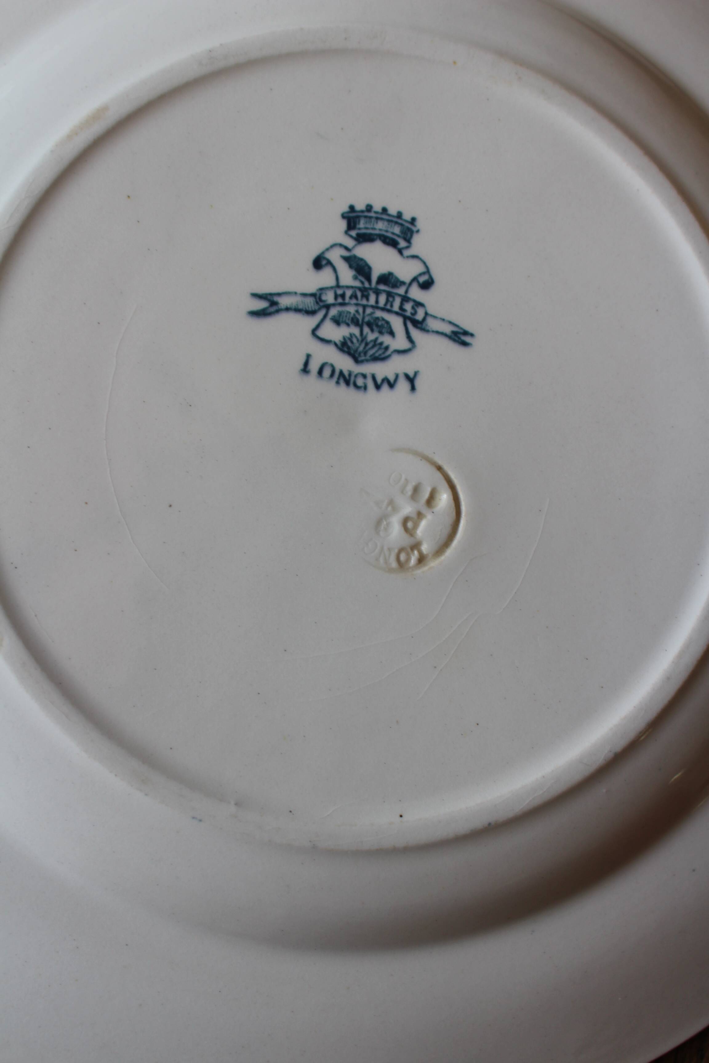 Set of 4 mismatched blue flat plates