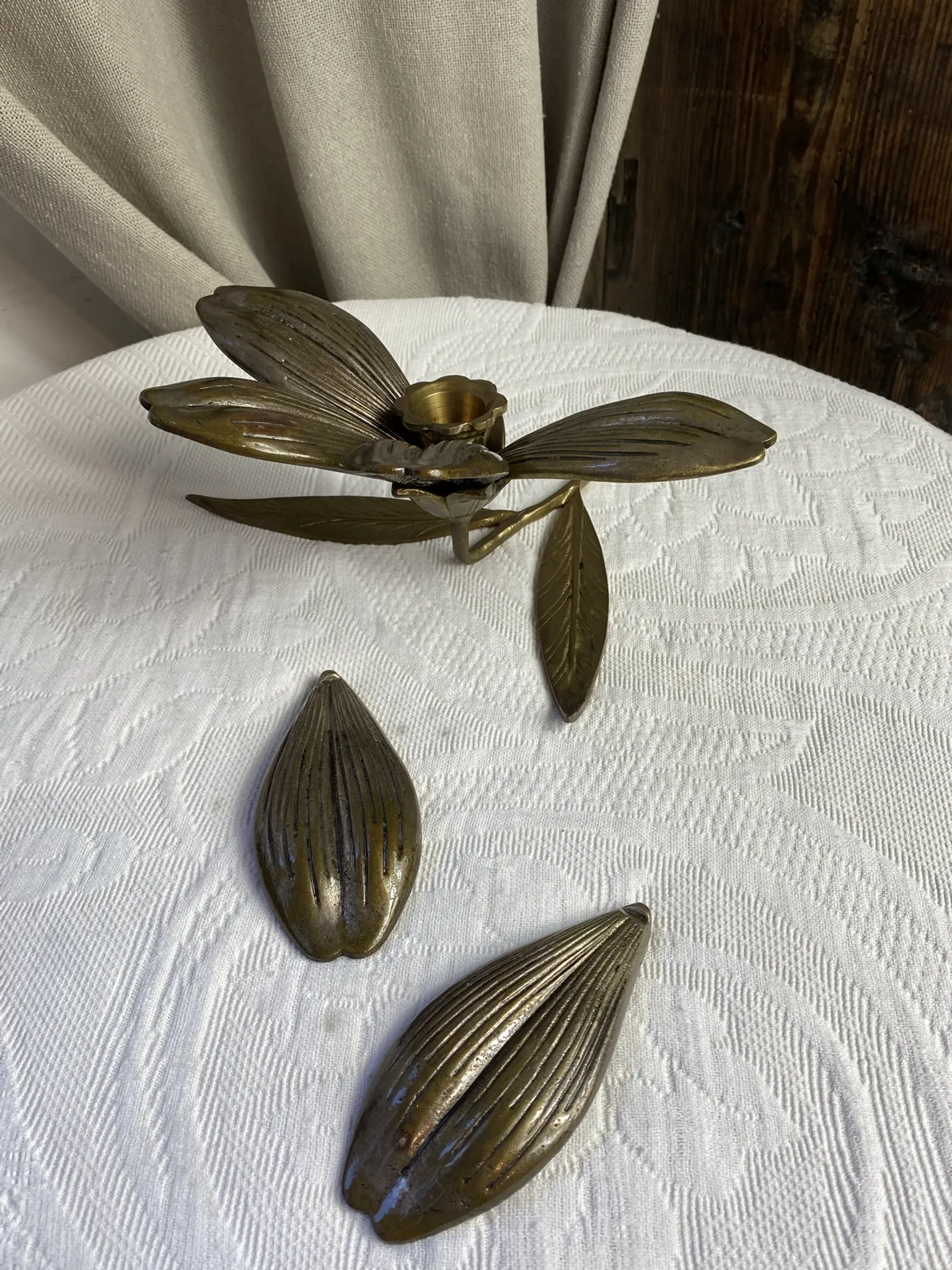 Flower candlestick and removable ashtrays in solid brass.