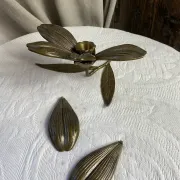 Flower candlestick and removable ashtrays in solid brass.