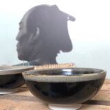 Lot of black ceramic-style bowls