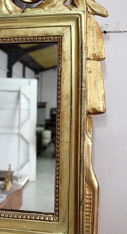 Miroir en bois doré, style Louis XVl, début XXe