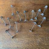 Series of 12 monogrammed silver metal knife holders