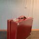 Red leather suitcase