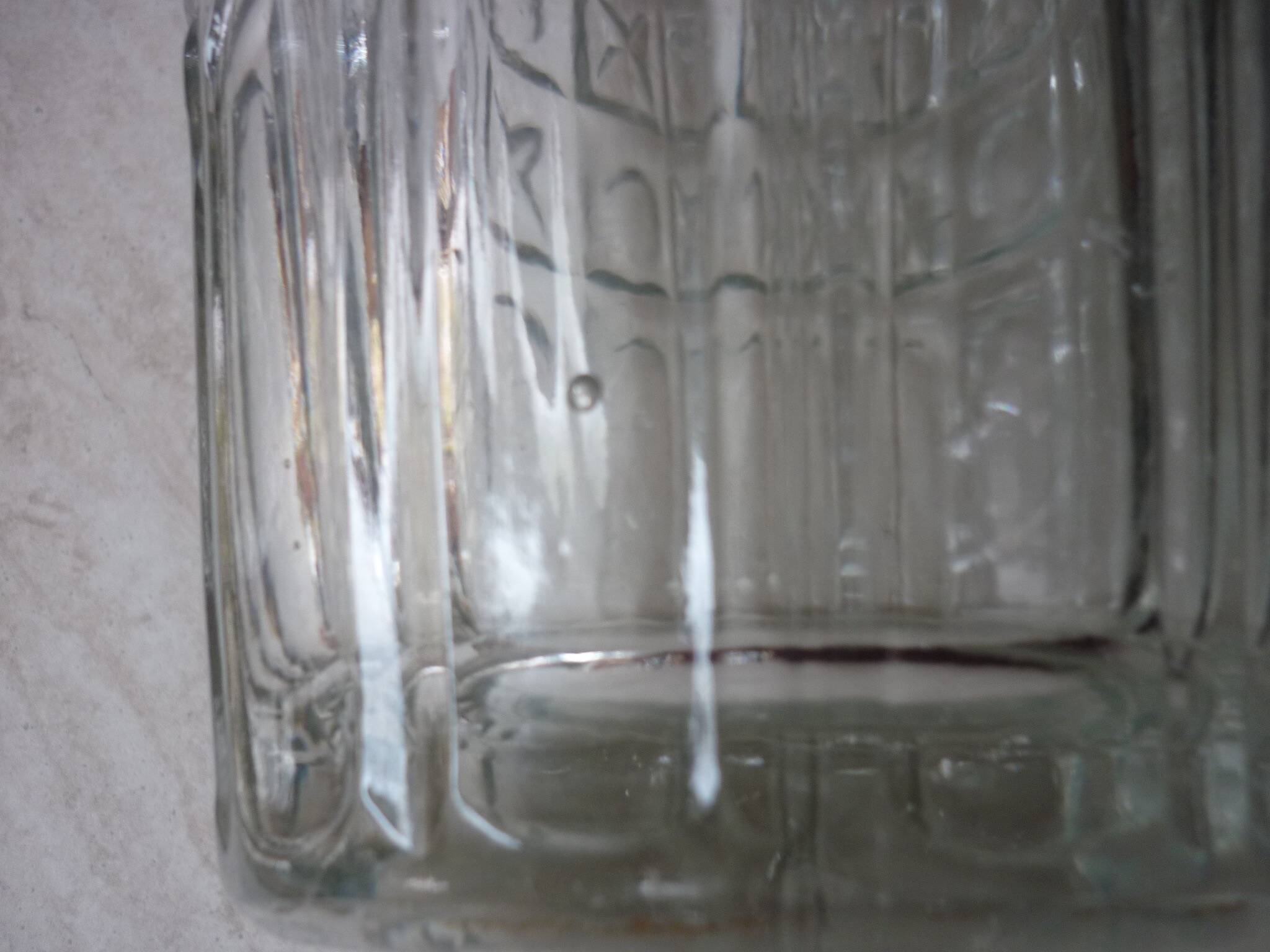 Transparent glass vase with art deco geometric patterns
