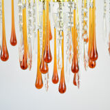 A pair of Mid Century 70's waterfall chandeliers. Murano glass amber drops. Paolo Venini style.