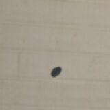 Oval mirror patinated brass frame art deco