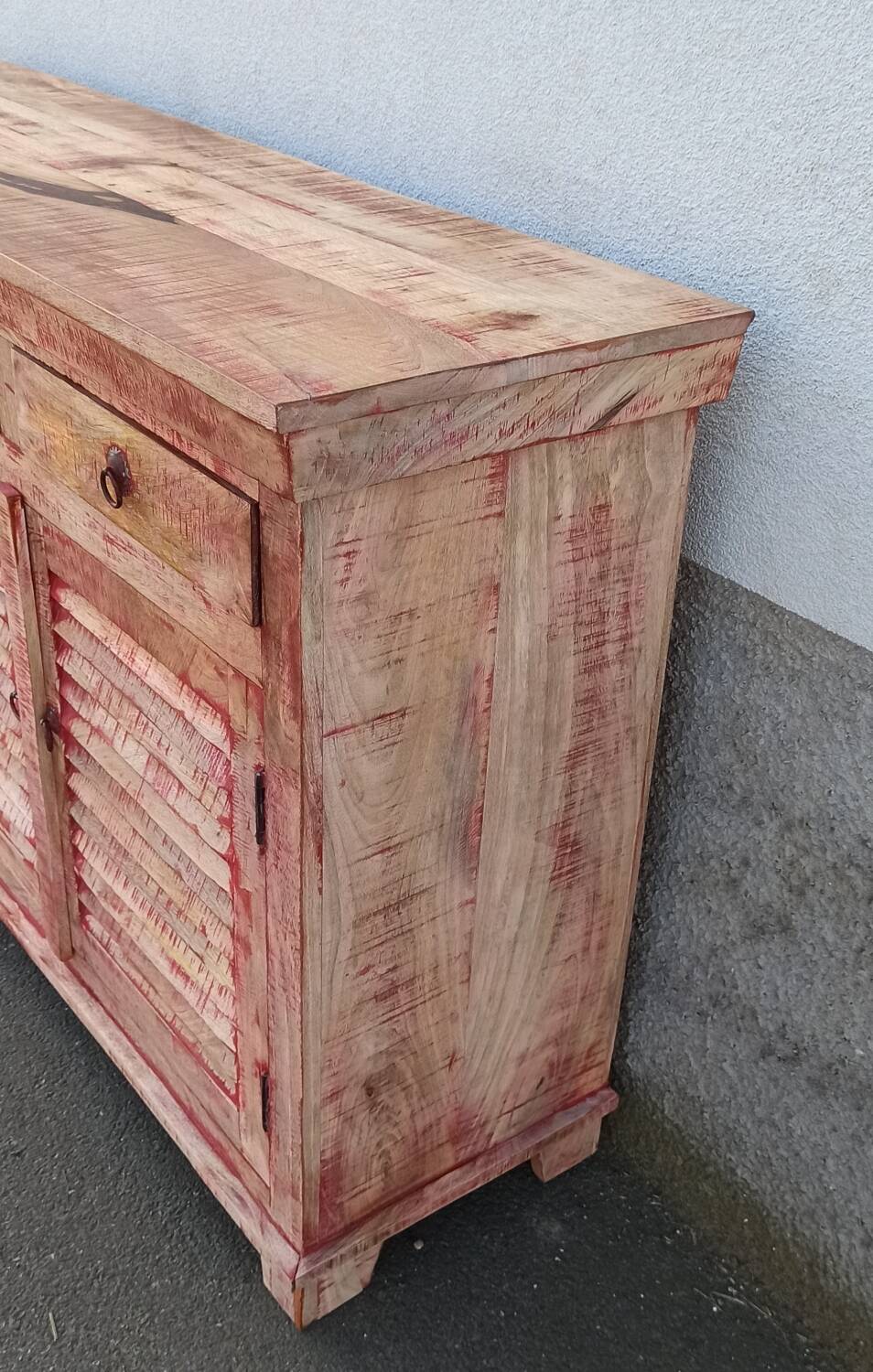 Wooden sideboard with red highlights