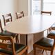 Set of 14 vintage chairs in solid wood and green leather.