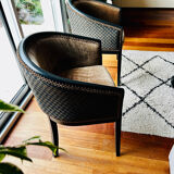 Pair of Art Deco barrel chairs in black and bronze