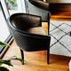Pair of Art Deco barrel chairs in black and bronze