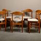 Henning Kjærnulf dining chairs set in Oak and Off White Bouclé, Denmark, 1960s