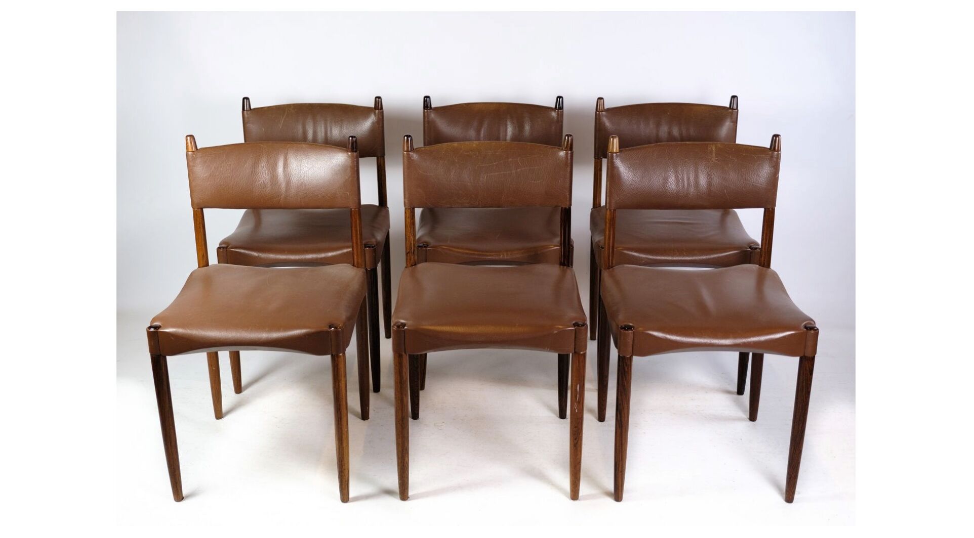 Set of 6 Chairs of Danish Design Made of Solid Rosewood with Brown Leather