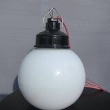 Trio of opal glass and bakelite globe pendant lights