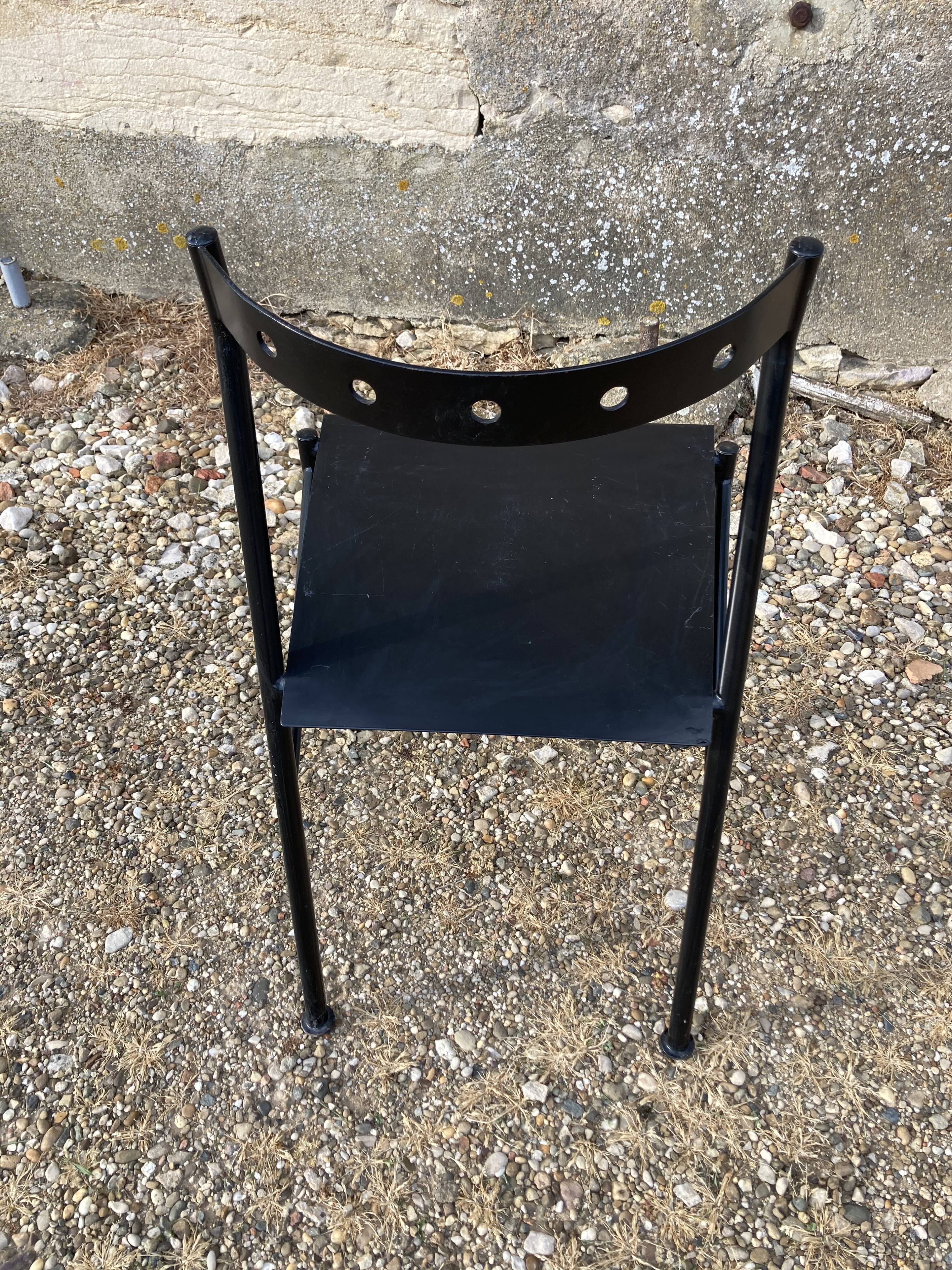 Series of 4 black iron chairs