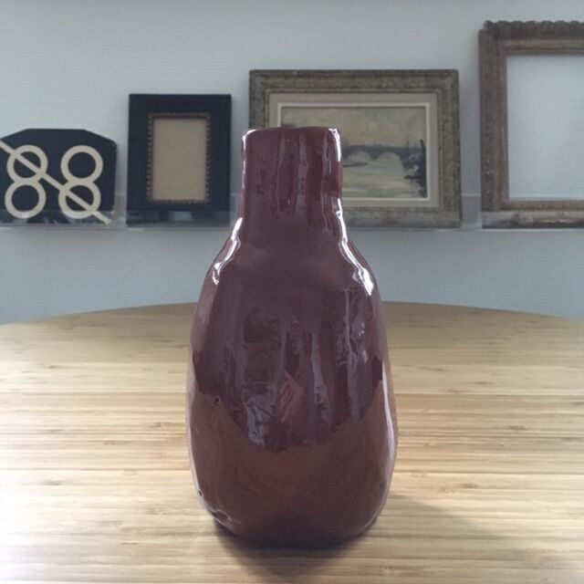 Bottle of chocolate brutalist vase