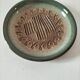 Signed stoneware bowl from Puisaye, relief decoration.