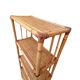 Bamboo and wicker bookshelf, vintage boho-chic from the '70s.