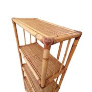 Bamboo and wicker bookshelf, vintage boho-chic from the '70s.