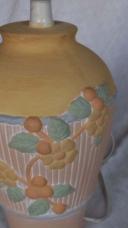 Terracotta lamp foot, floral decoration in strong relief.