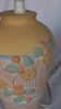 Terracotta lamp foot, floral decoration in strong relief.