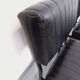 Set of 2 vintage modernist armchairs in black faux leather and metal.