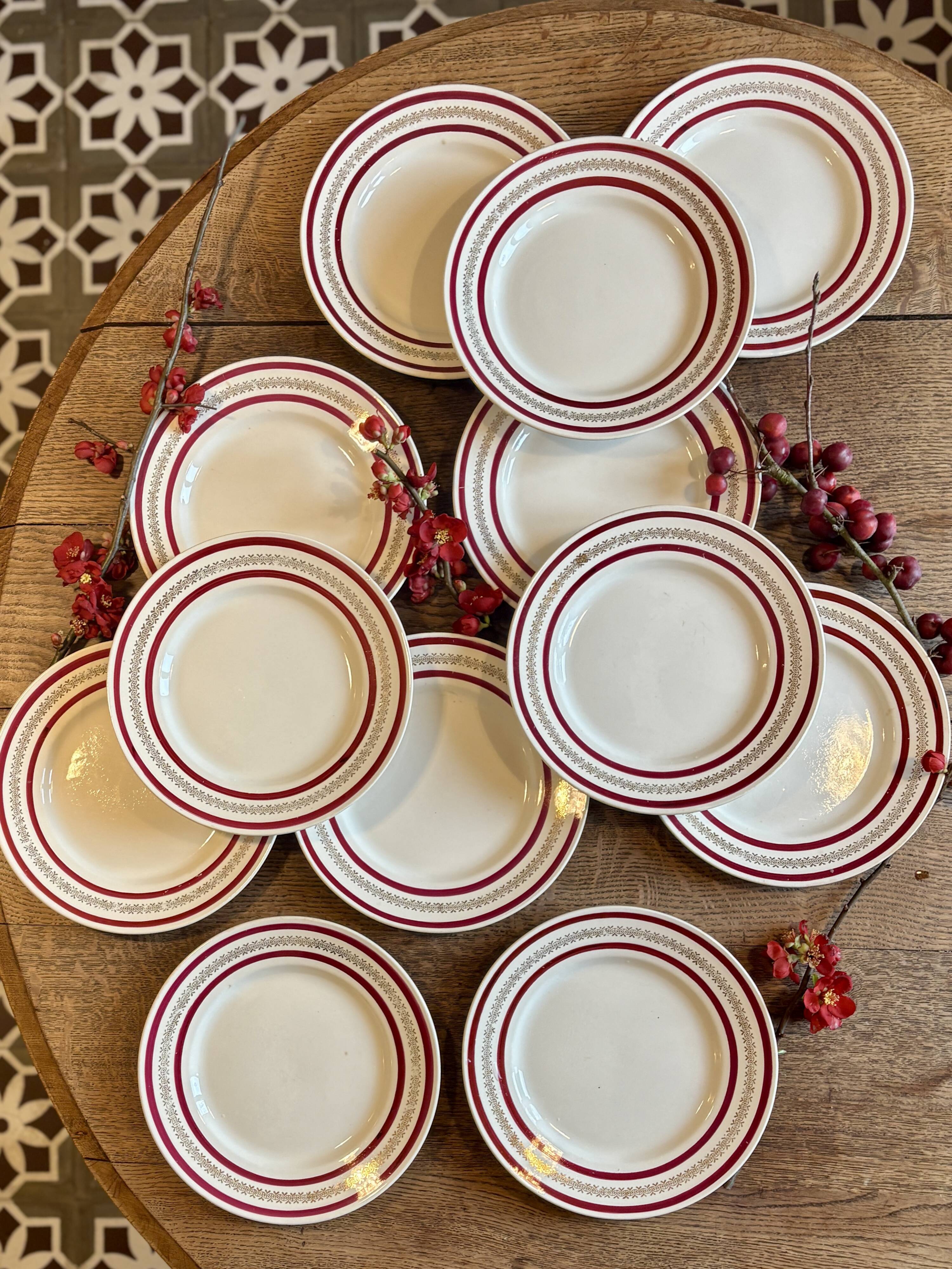Set of 12 antique Gien red and gold dinner plates.