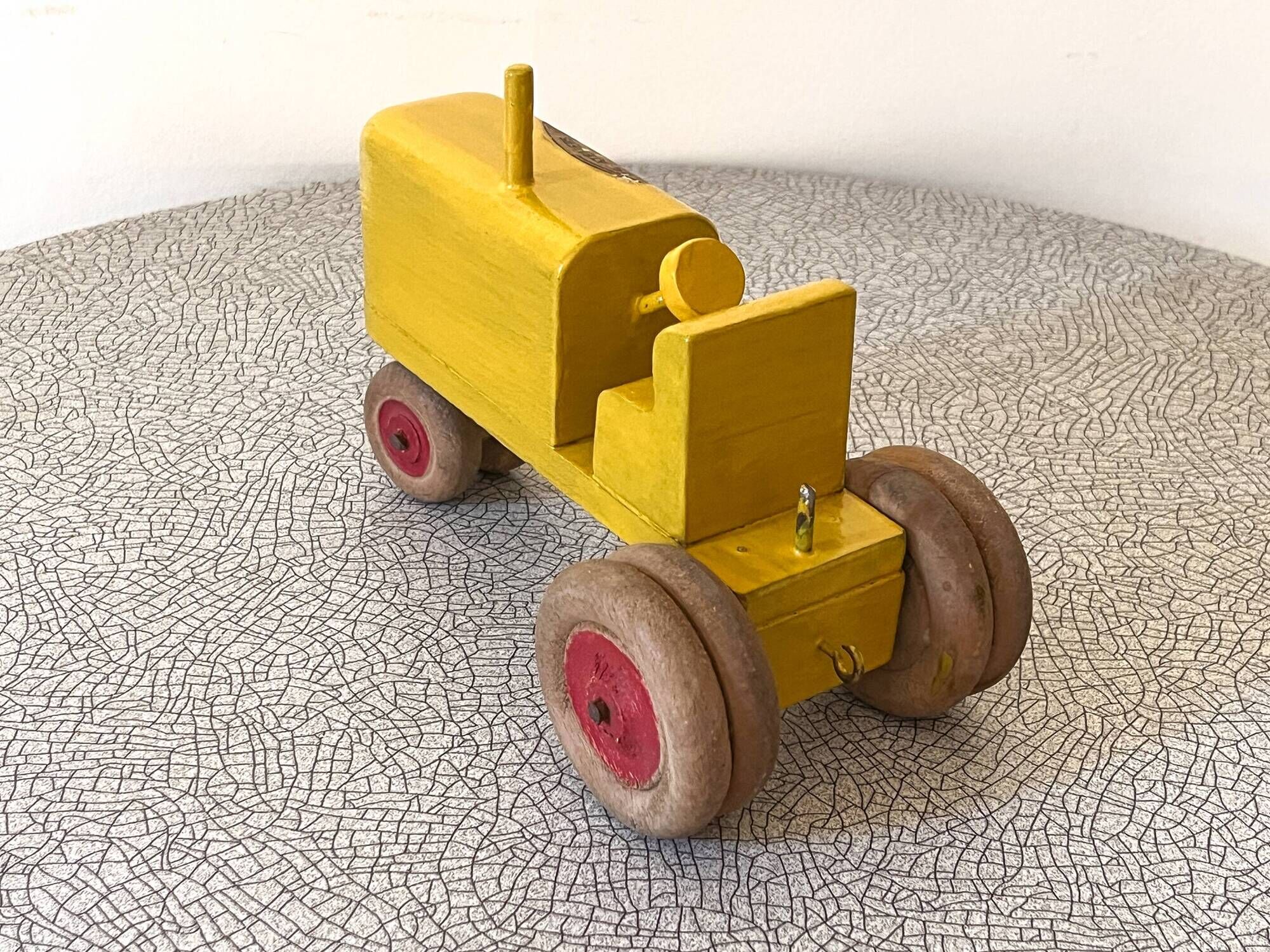 Wooden tractor from the French brand "Ateliers du Père Noël"