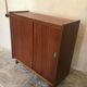 Vintage storage cabinet teak veneer sliding door compass feet