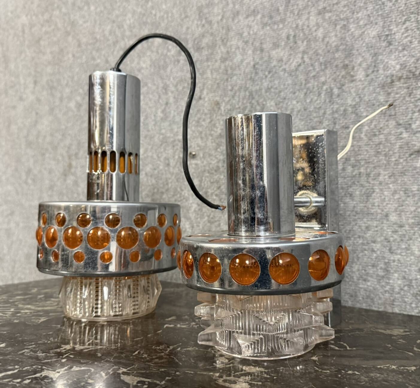 Two vintage space age pendant lamps by Raak, 1970