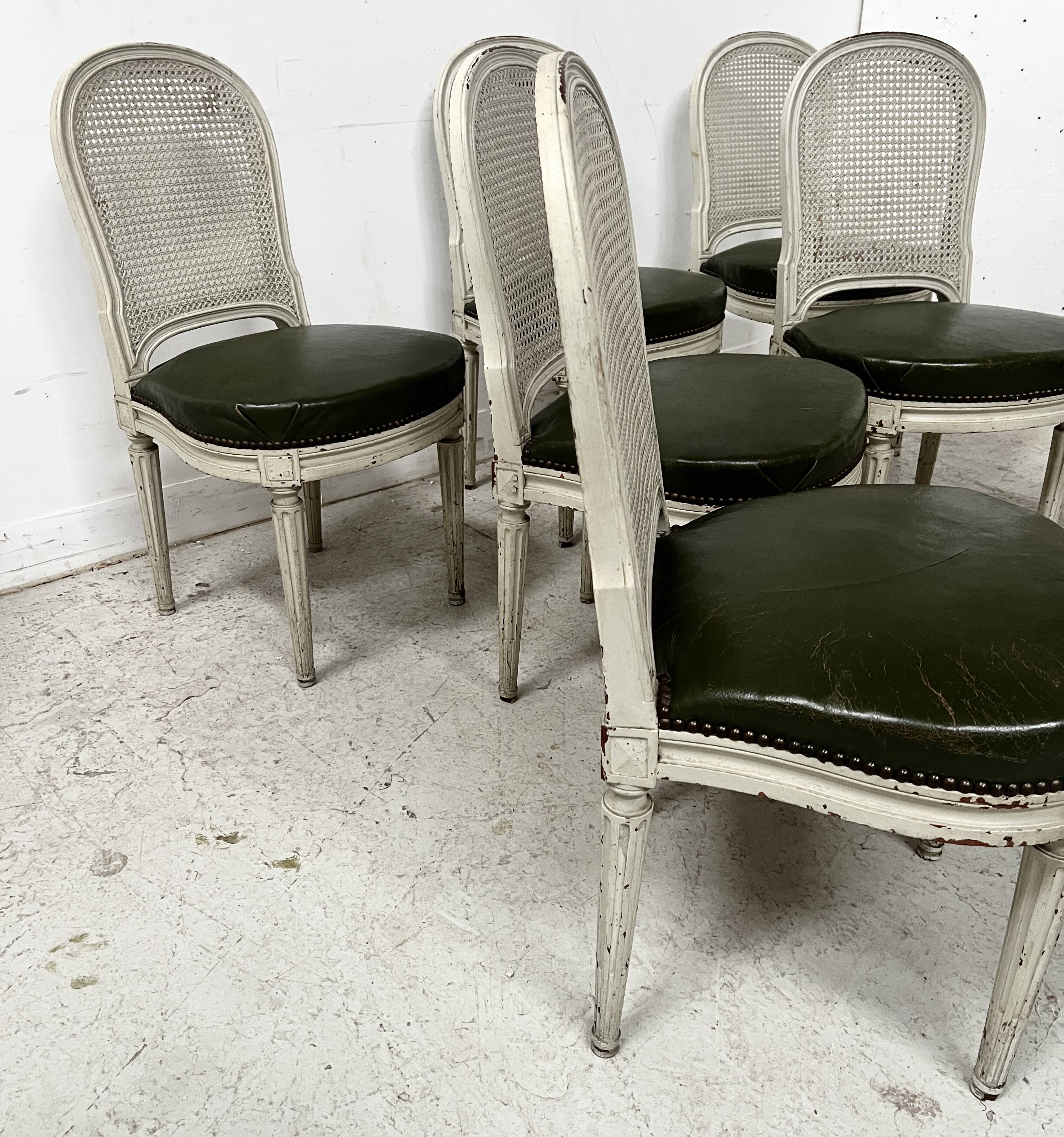 Set of seven Louis XVI style chairs in patinated beech, 20th century.