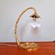 Art Nouveau table lamp in gilded bronze and opalescent glass