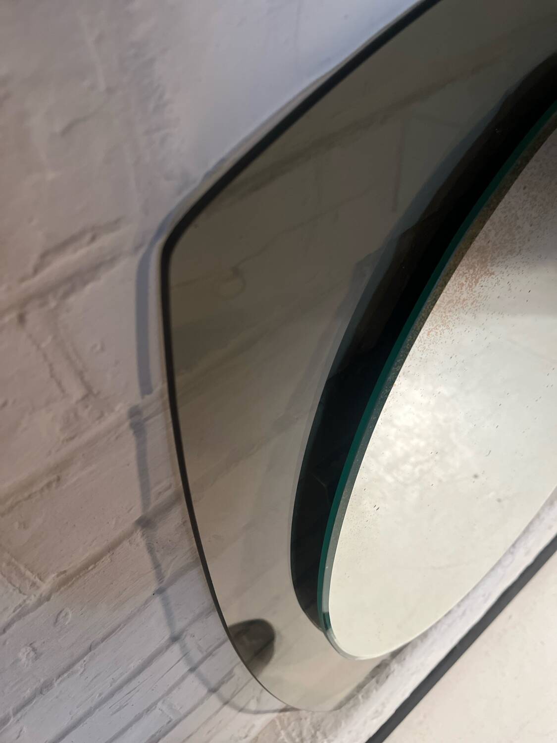 Vintage smoked glass mirror from around 1970.