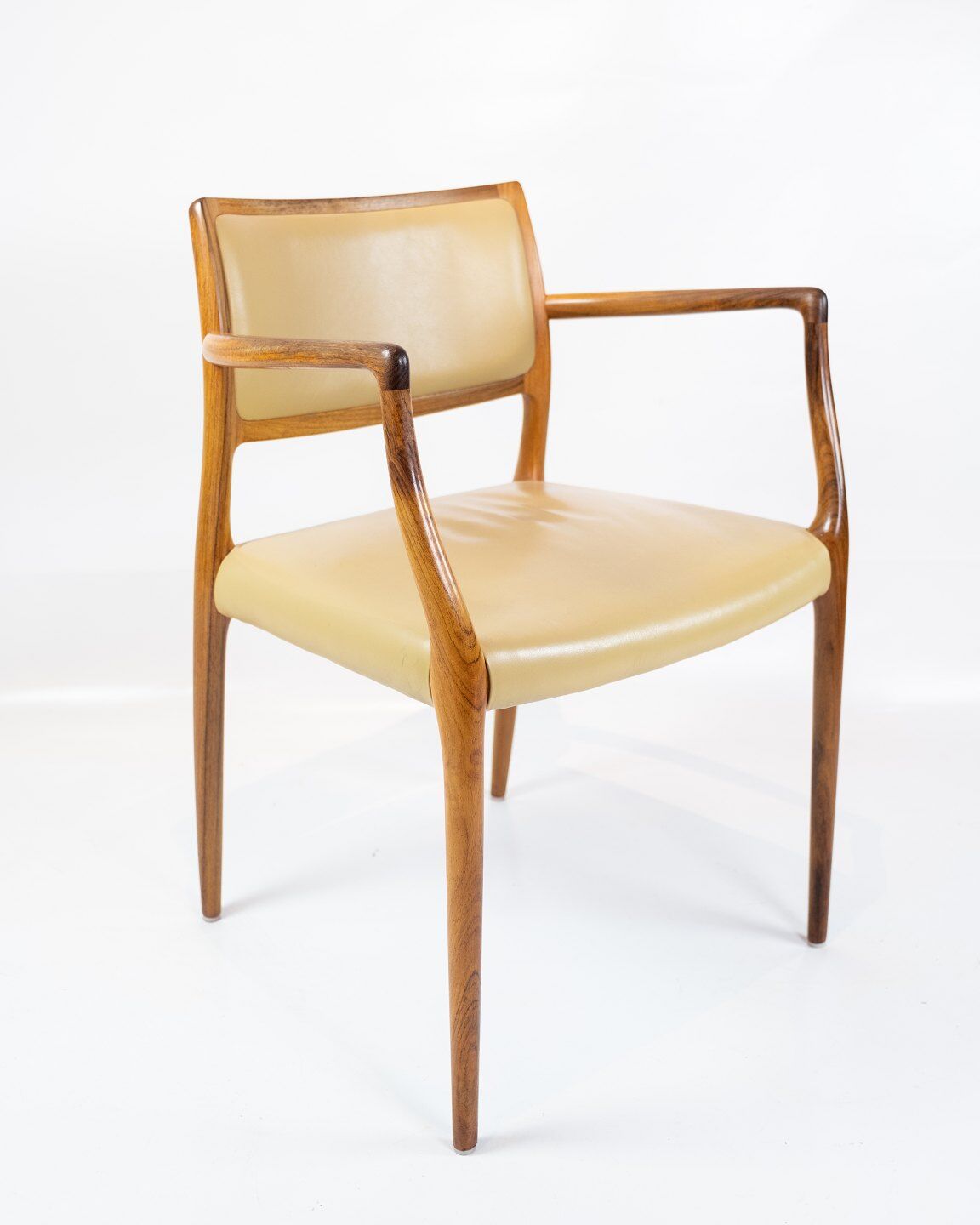 Pair of N.O. Moeller armchairs, model 65, in rosewood and light leather