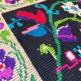 Romanian wool carpet floral design with green border on black background 180x153cm