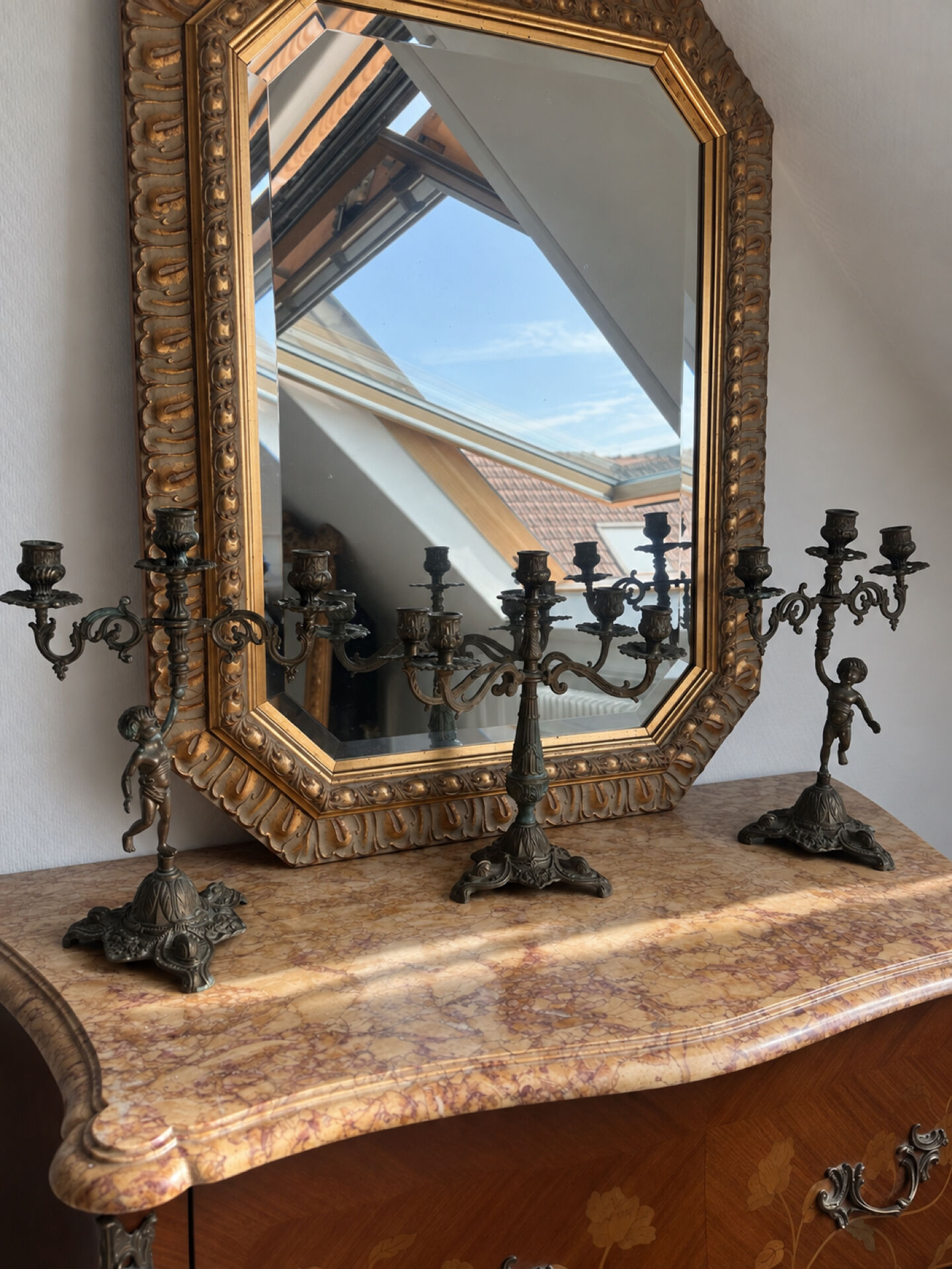 Set of 3 antique three-branch candelabras with cherubs and bronze patina.