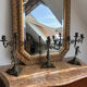 Set of 3 antique three-branch candelabras with cherubs and bronze patina.