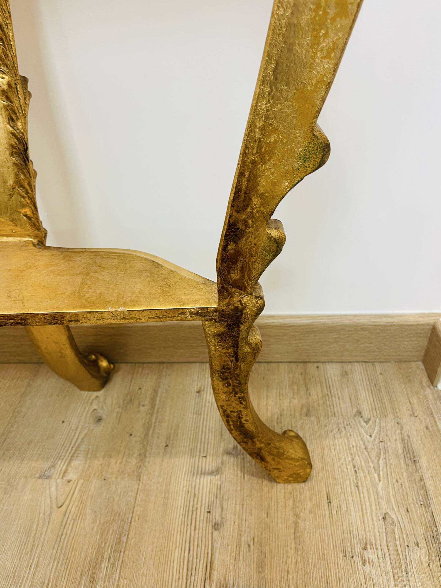 Golden console in Louis XV Rococo style made of resin.