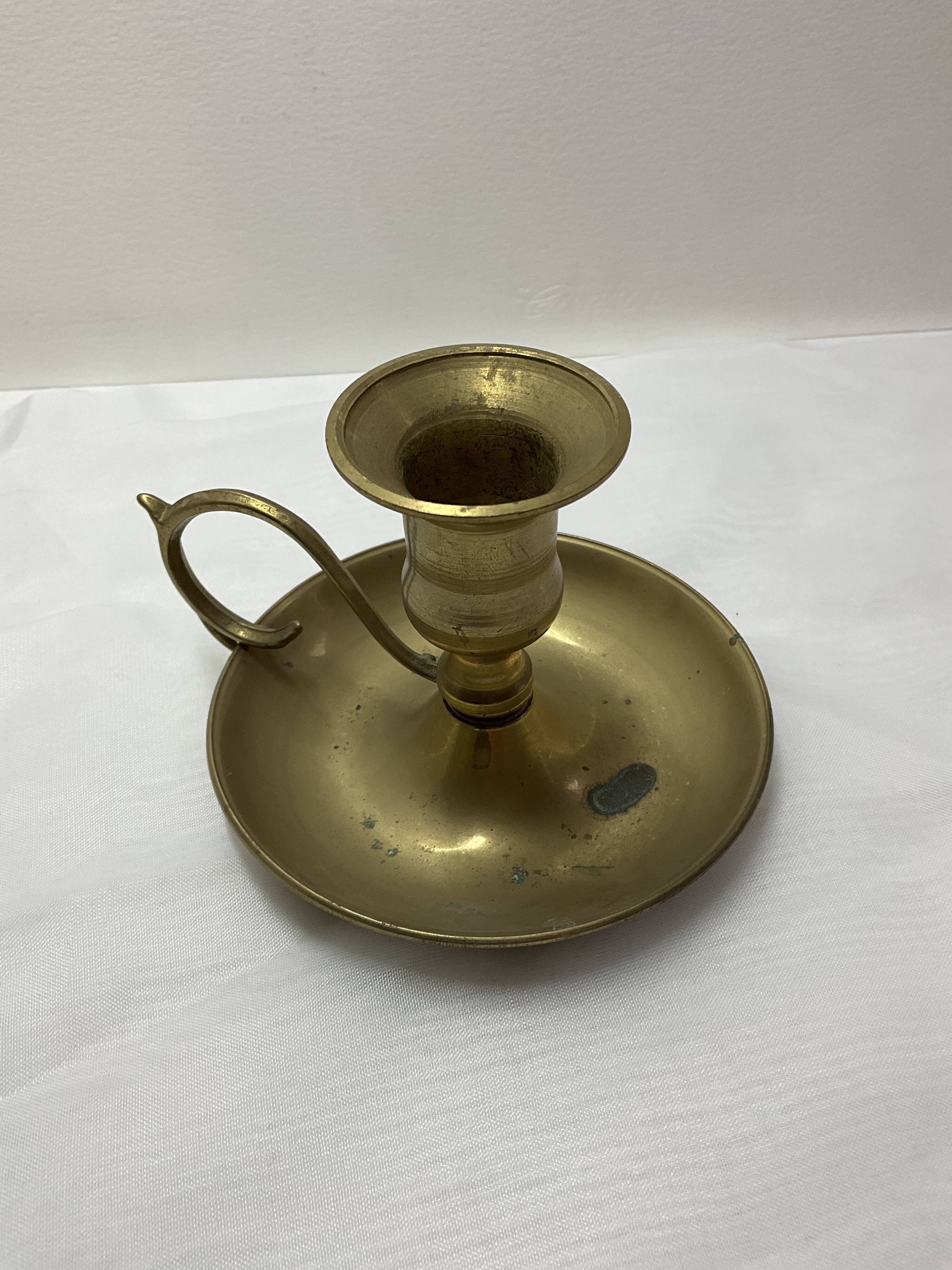 Brass hand candle holder