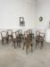 Suite de 12 chaises de bistrot à gaufrage végétal 1920