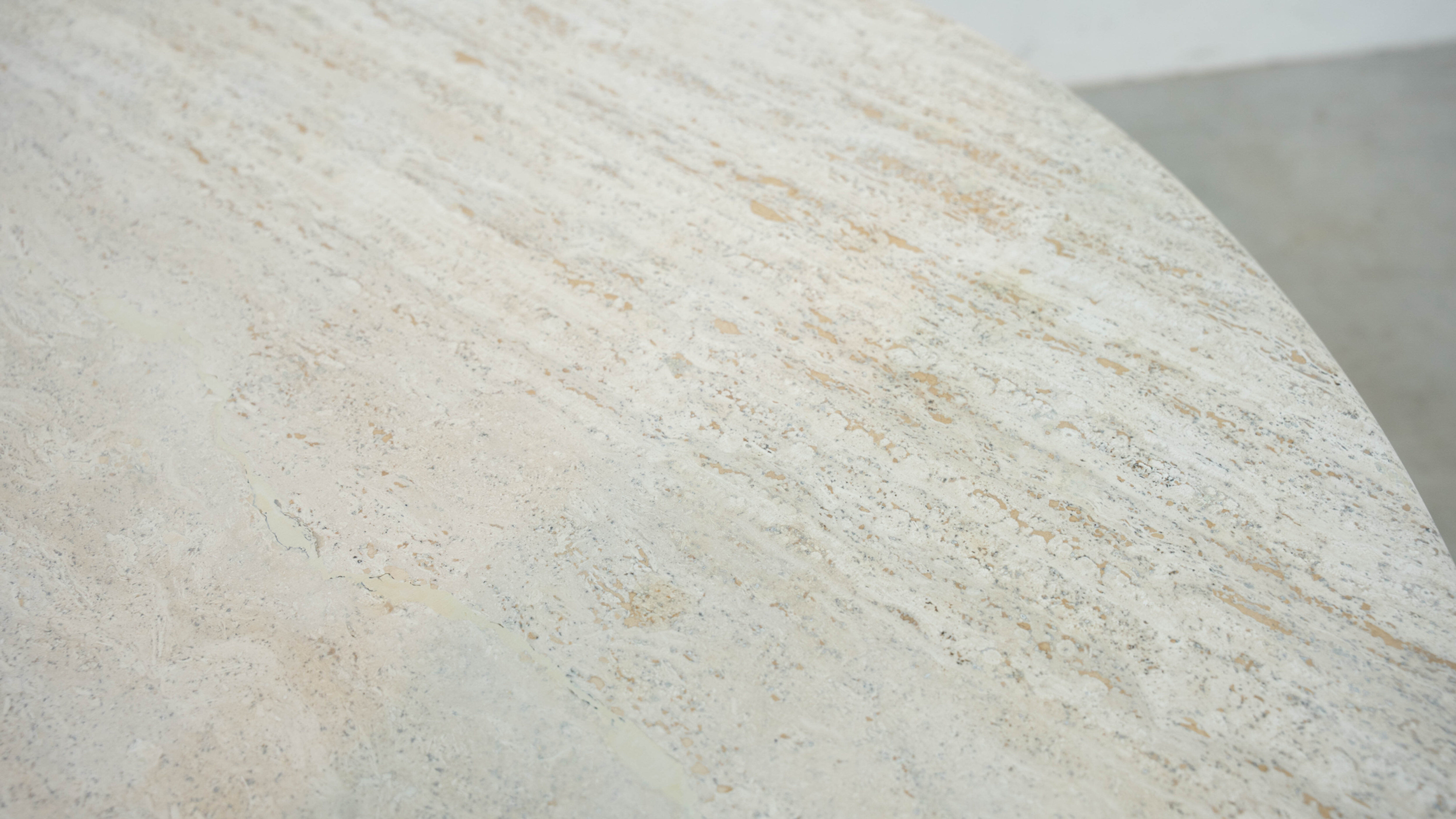 Round Belgian travertine dining table