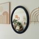 Vintage oval mirror in petrol blue wood