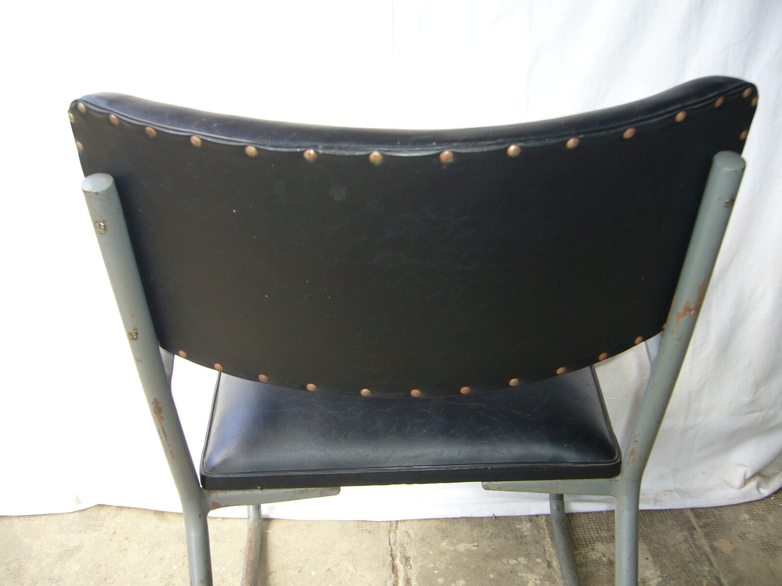 Old industrial chair in skai and metal